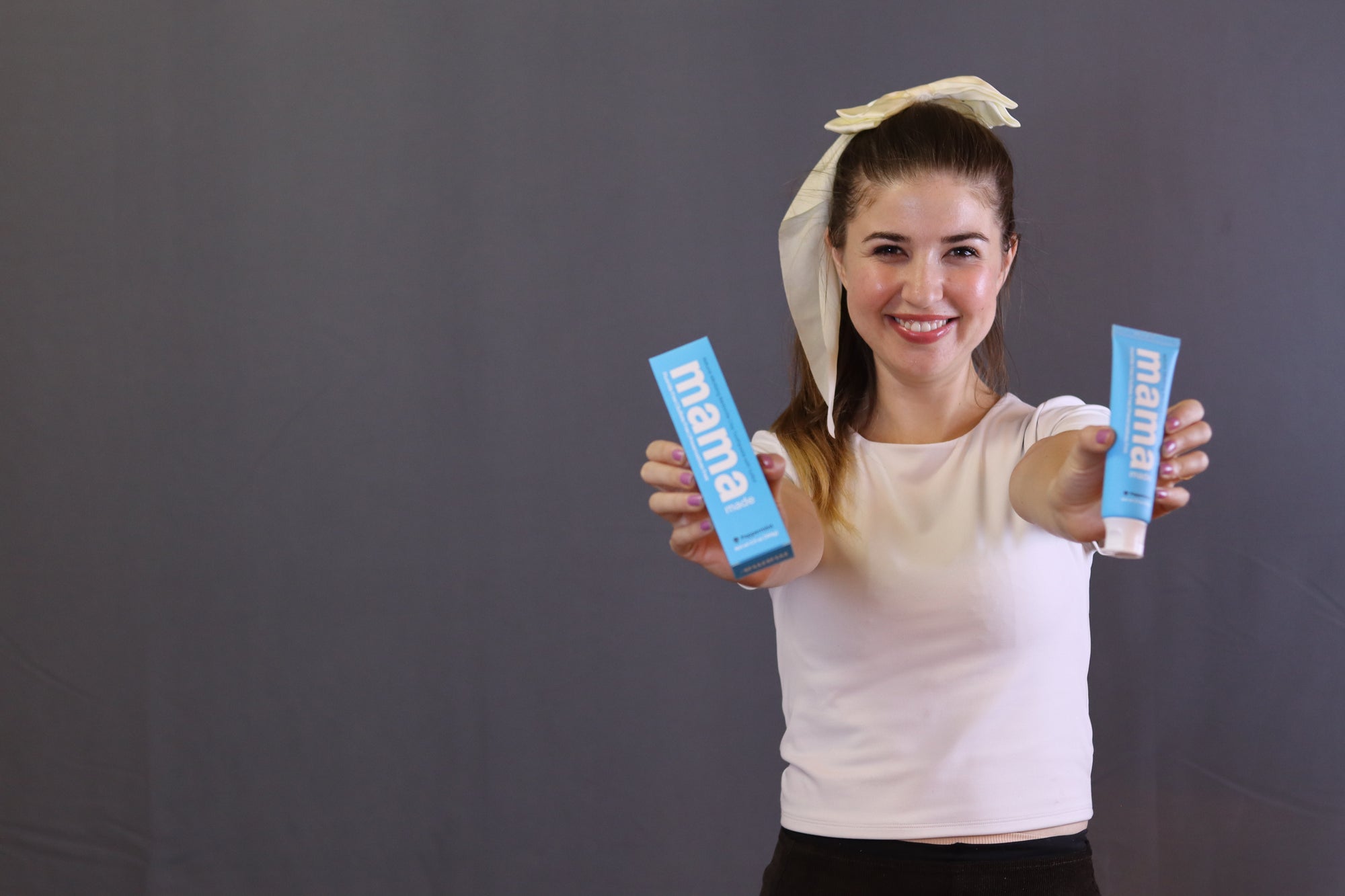 Nadia Ajdari holding Mama Made 100% Natural Bentonite Clay Toothpaste Fluoride-free 