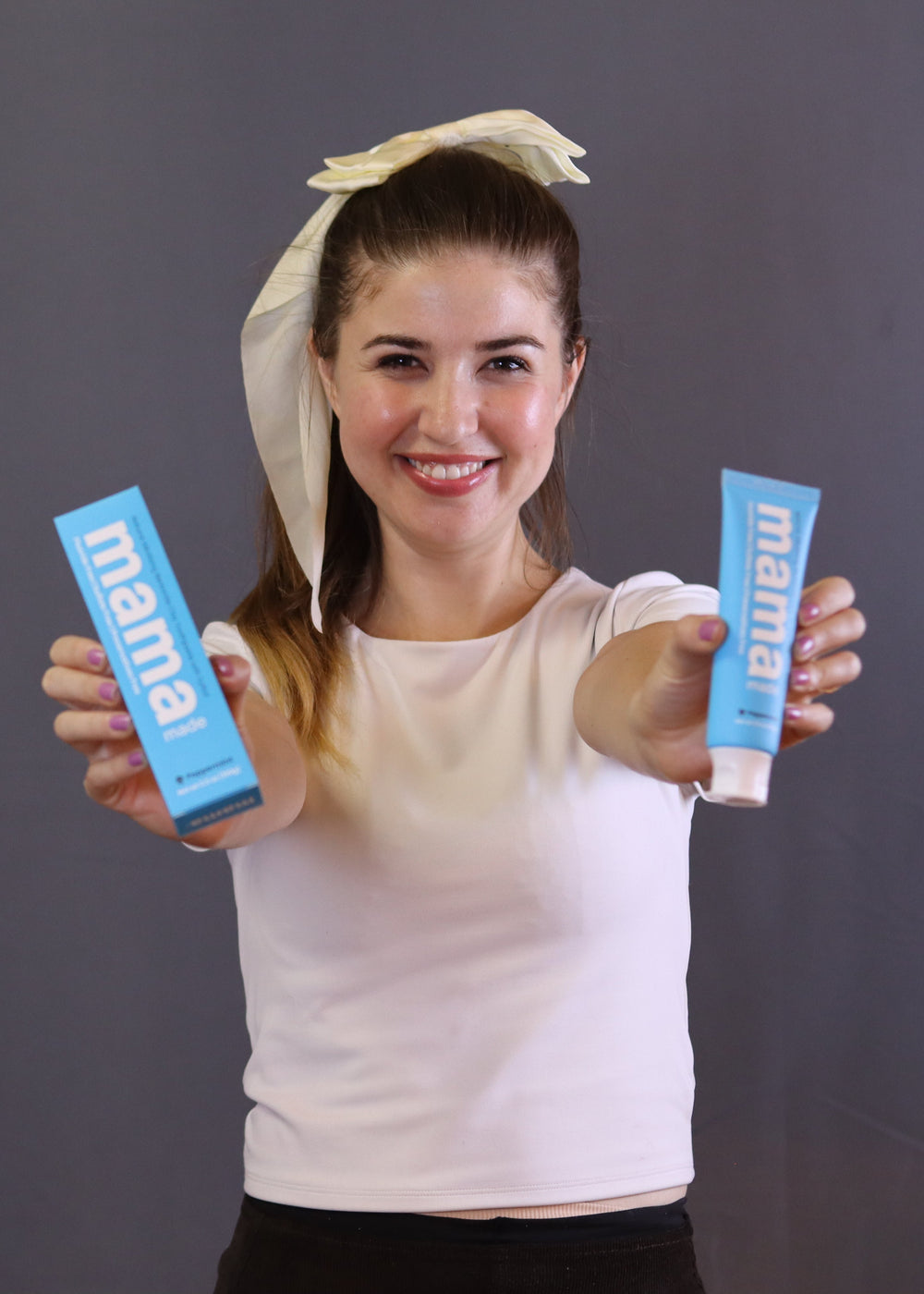 Nadia Ajdari holding Mama Made 100% Natural Bentonite Clay Toothpaste Fluoride-free 