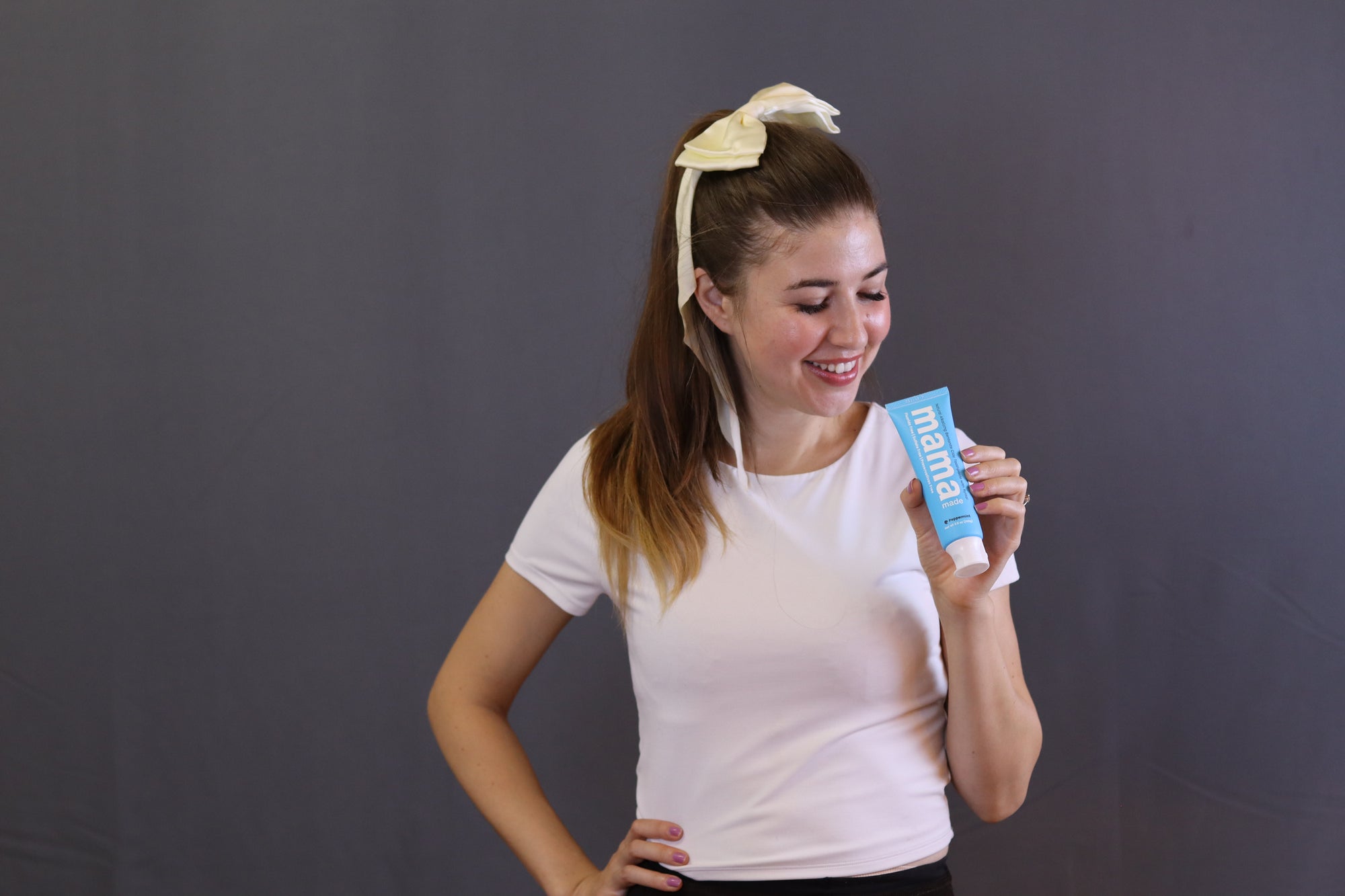 Nadia Ajdari holding Mama Made 100% Natural Bentonite Clay Toothpaste Fluoride-free 